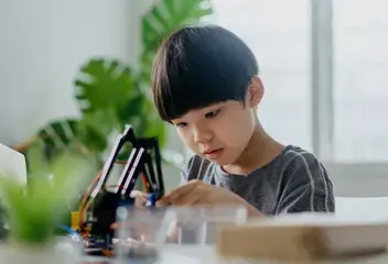 Kids concentrate in building lego robot at Advaspire Semenyih Centre