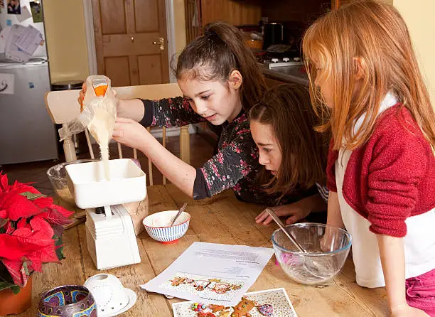 Kid measuring cooking recipe