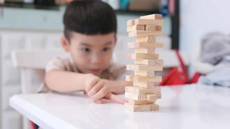 Kid playing wooden block