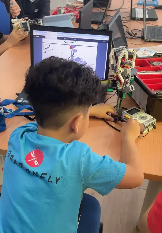 Student building lego folloeing instruction