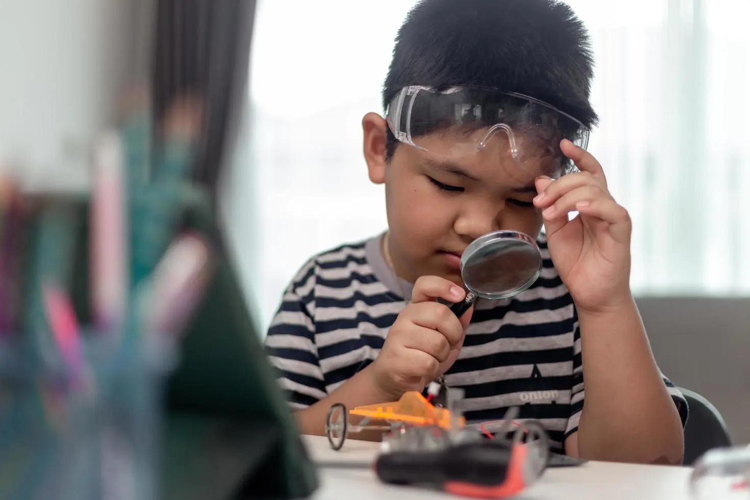 Young asia student learn robotics ae940c