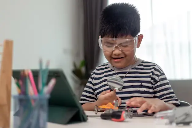 Young asia student learn robotics