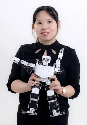 Advaspire robotics trainer, Ivy Ng with robot man